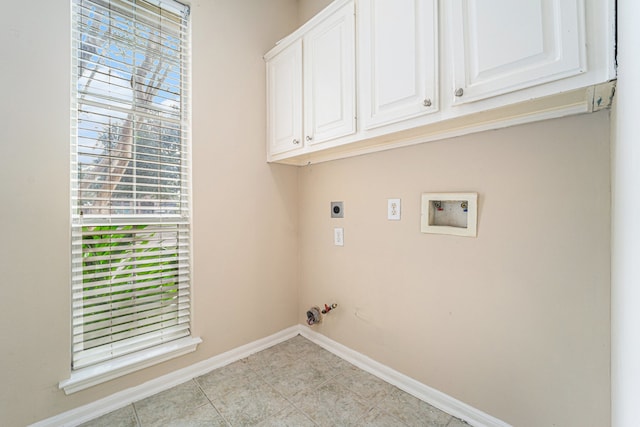 clothes washing area with hookup for an electric dryer, hookup for a gas dryer, cabinets, and hookup for a washing machine