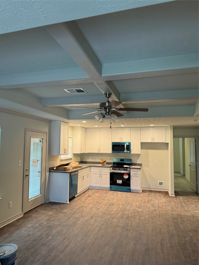 kitchen featuring white cabinets, appliances with stainless steel finishes, dark wood-type flooring, and beam ceiling