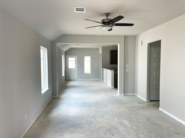 empty room featuring ceiling fan and lofted ceiling