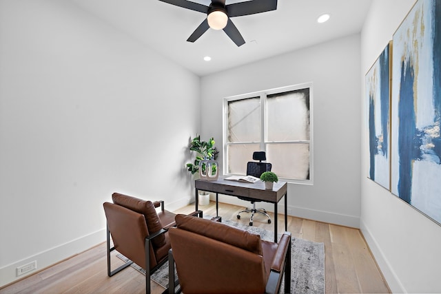 office space with ceiling fan and light hardwood / wood-style floors