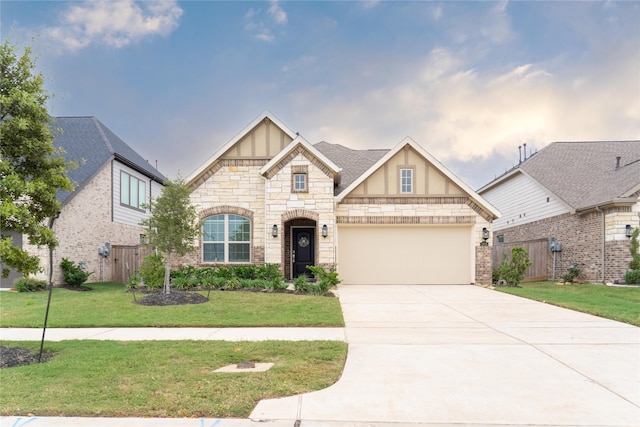 view of front of house with a front yard and a garage