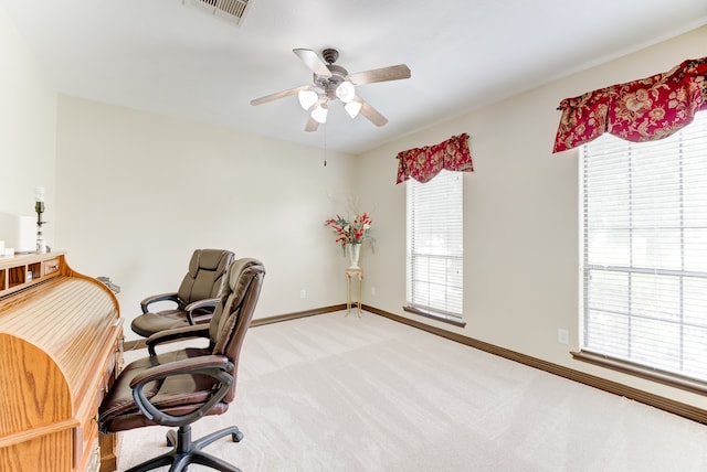 office area featuring ceiling fan and light carpet