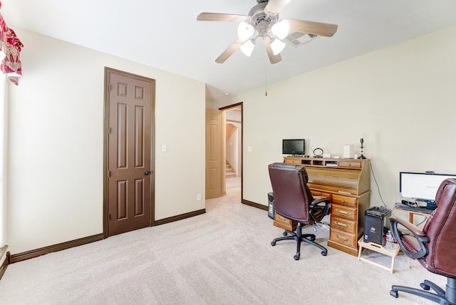 office space featuring ceiling fan and light colored carpet