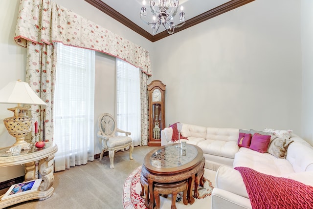 living room with a chandelier, light colored carpet, and ornamental molding