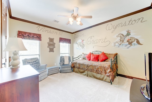 carpeted bedroom with ceiling fan and ornamental molding