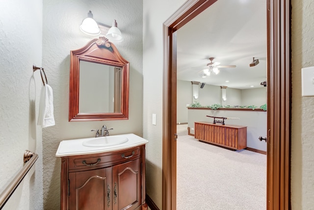 bathroom featuring vanity and ceiling fan