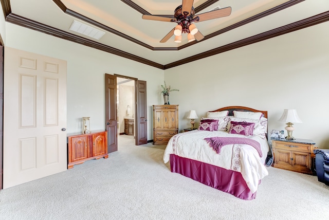 carpeted bedroom with ceiling fan, ornamental molding, and ensuite bath