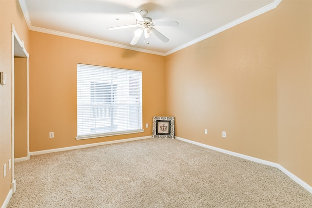 empty room featuring carpet flooring, ceiling fan, and ornamental molding