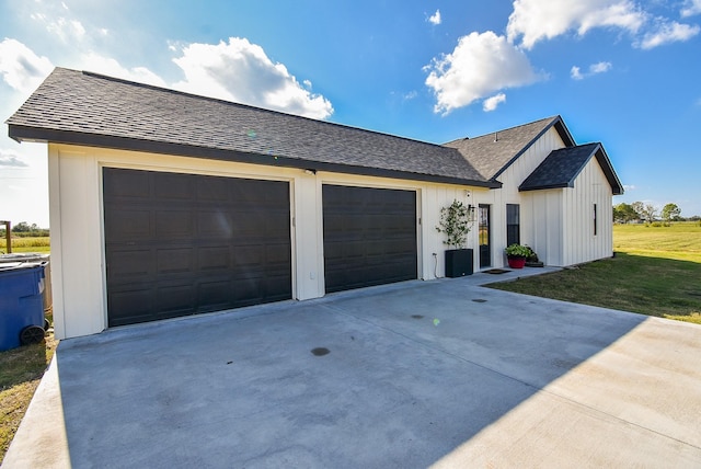 15007 Barak Rd Unit P, Guy, TX 77444 - view of front of property with concrete driveway, an attached garage, a shingled roof, and a front lawn