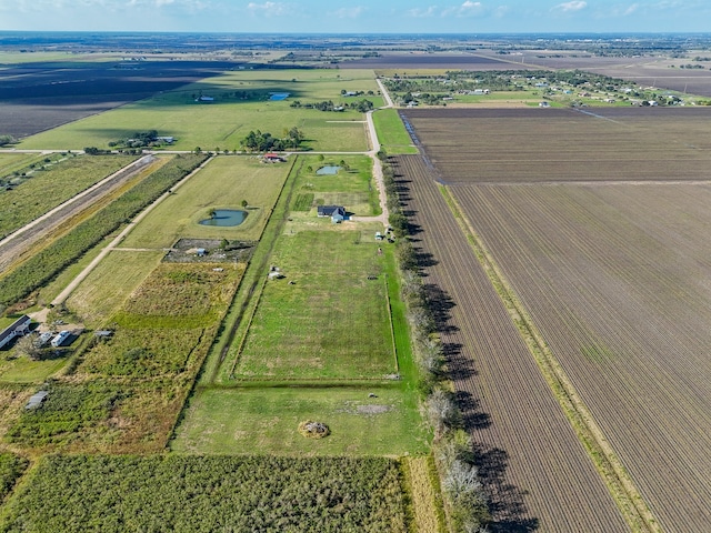 birds eye view of property with a rural view