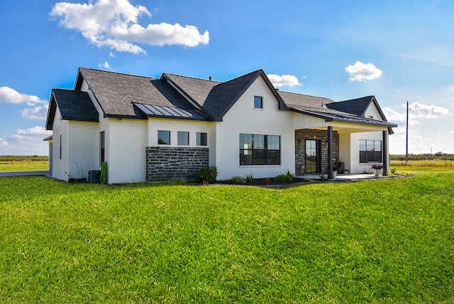 15007 Barak Rd Unit P, Guy, TX 77444 - rear view of property featuring brick siding, a shingled roof, and a yard