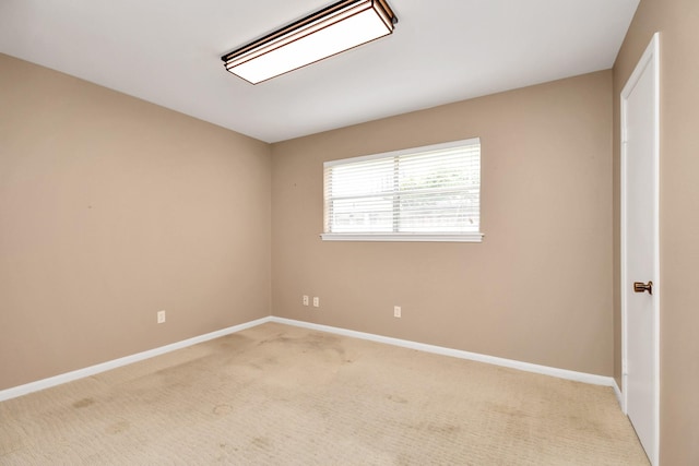 empty room featuring light carpet