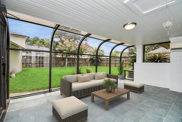 sunroom with wooden ceiling and a wealth of natural light