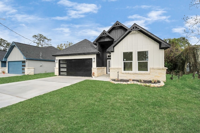 view of front facade with a front yard and a garage