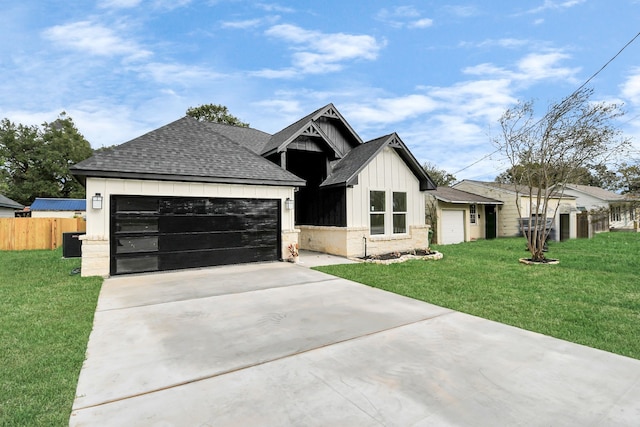 view of front of home featuring a garage and a front yard