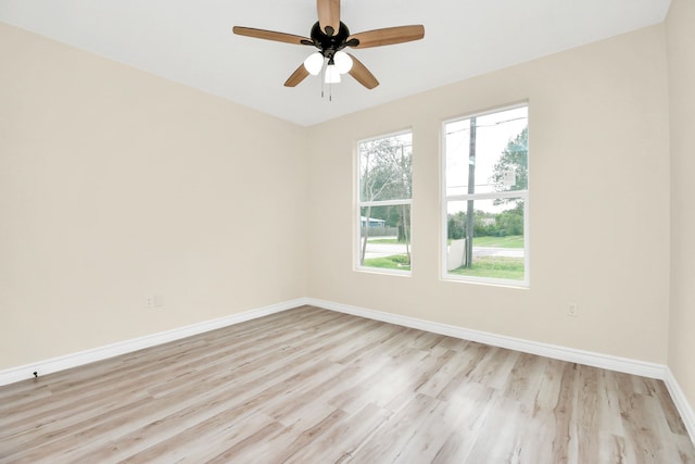 empty room featuring ceiling fan and light hardwood / wood-style flooring