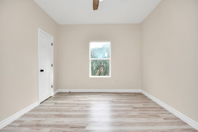 empty room with light wood-type flooring and ceiling fan