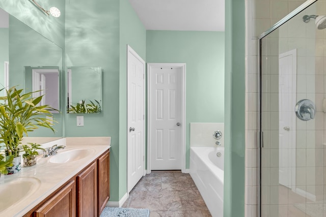 bathroom featuring vanity and independent shower and bath