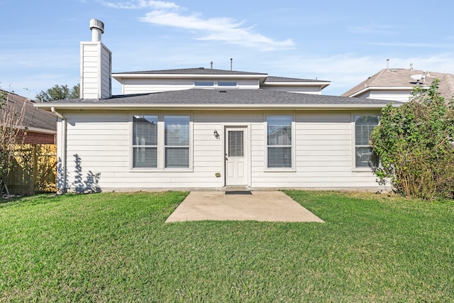 rear view of property with a patio area and a lawn