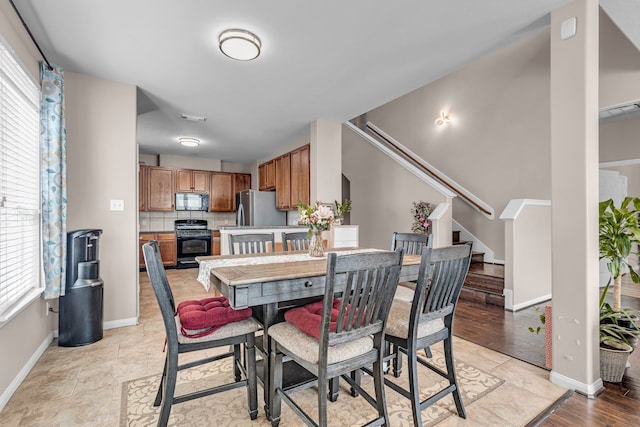 dining area with light hardwood / wood-style floors