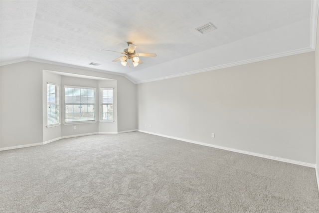 spare room with carpet flooring, a textured ceiling, ceiling fan, and lofted ceiling