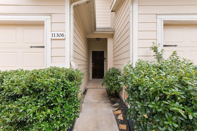 doorway to property featuring a garage