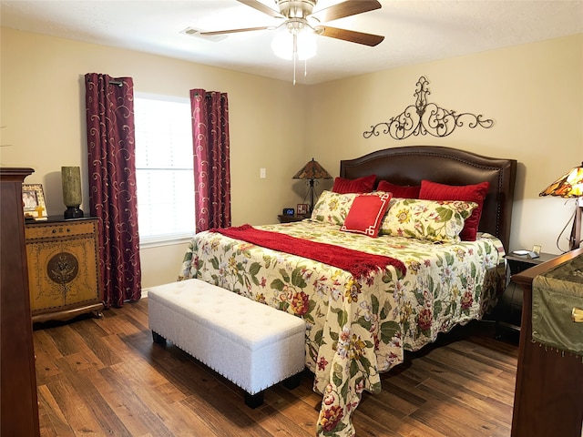 bedroom featuring dark wood-type flooring and ceiling fan