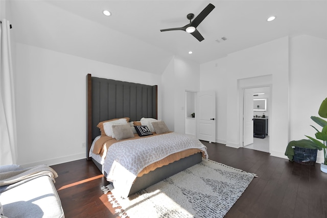 bedroom featuring dark hardwood / wood-style floors, ensuite bath, and ceiling fan