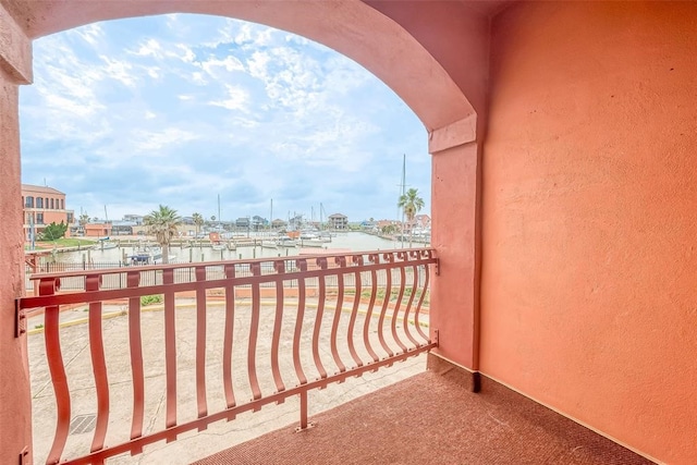 balcony featuring a water view