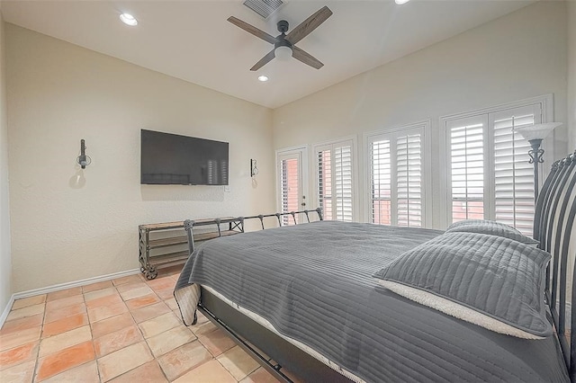 bedroom with multiple windows and ceiling fan