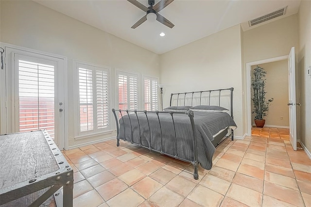 bedroom with ceiling fan and light tile patterned flooring