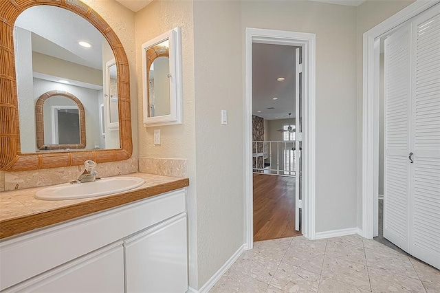 bathroom with vanity and hardwood / wood-style flooring