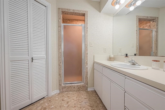 bathroom with vanity and an enclosed shower