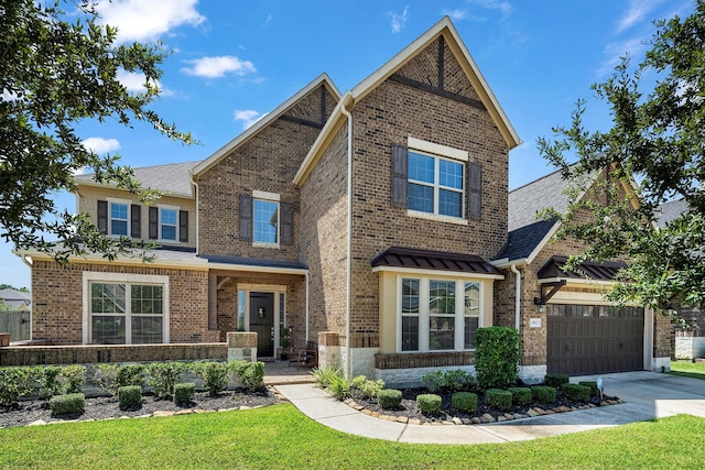 craftsman inspired home with a garage and a front lawn