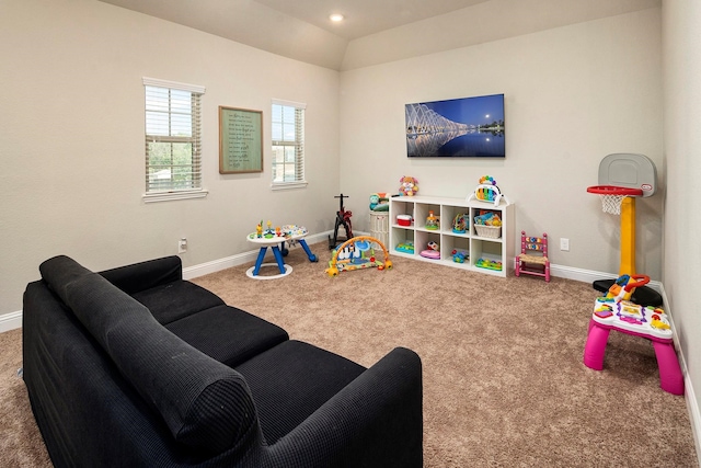 recreation room with carpet and lofted ceiling