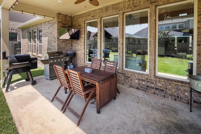 view of patio featuring a grill and ceiling fan