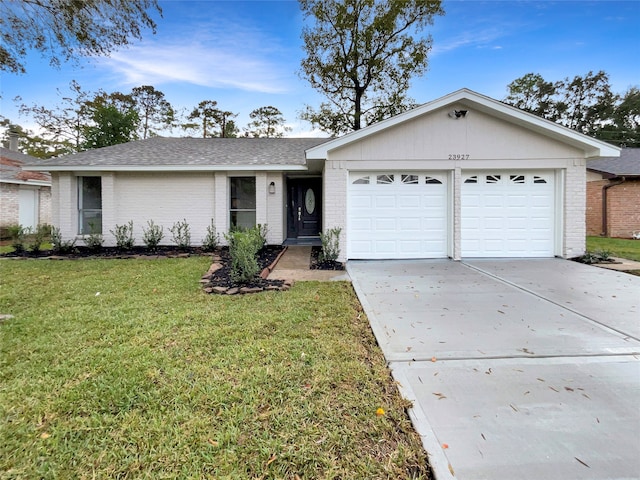 ranch-style home featuring a front yard and a garage