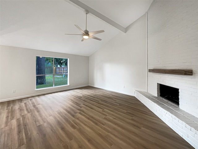 unfurnished living room with ceiling fan, dark wood-type flooring, beamed ceiling, high vaulted ceiling, and a fireplace