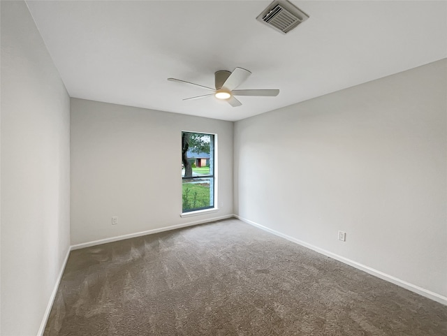 carpeted empty room with ceiling fan