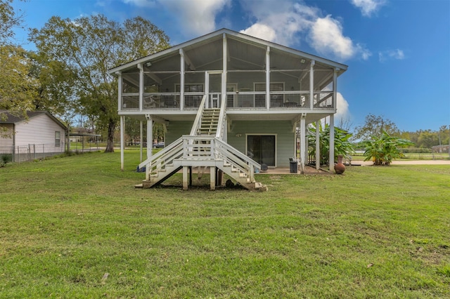 back of house with a lawn