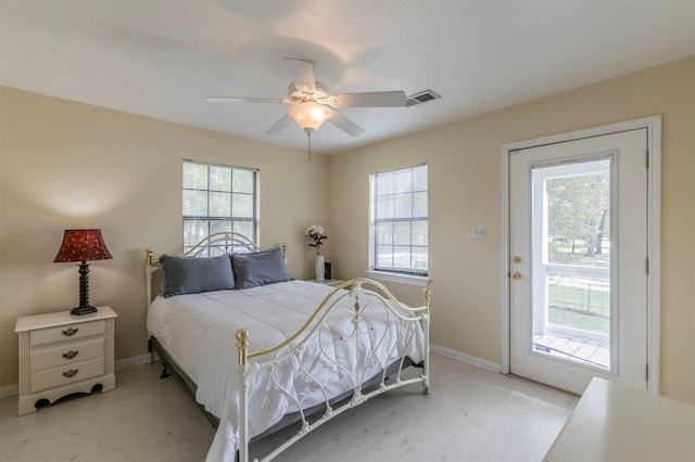 bedroom with ceiling fan and light hardwood / wood-style flooring