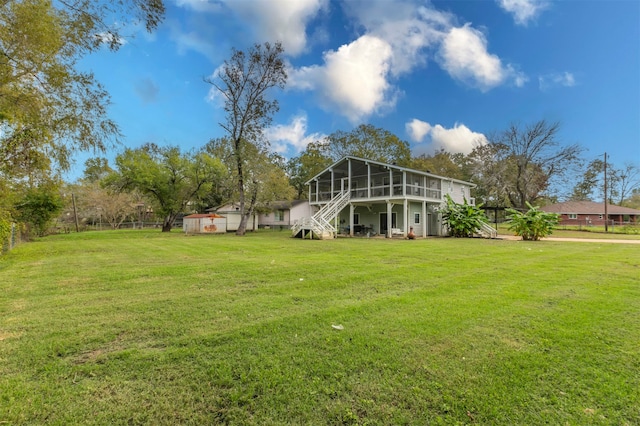 view of yard with a sunroom