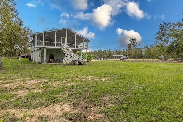 view of yard with a sunroom