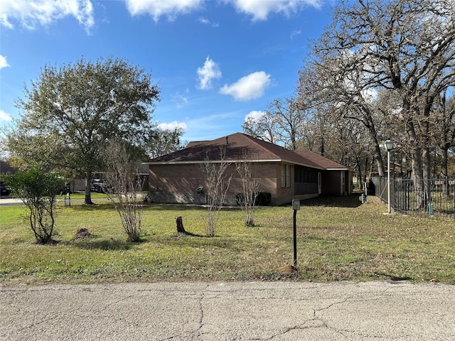 view of property exterior with a yard