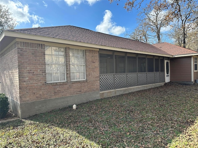 view of home's exterior featuring a sunroom