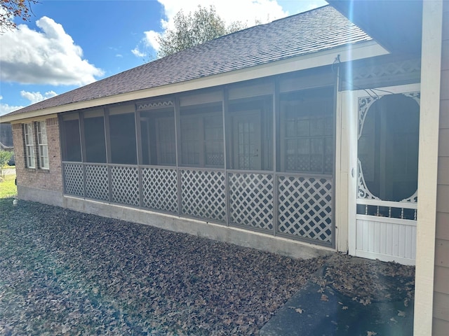 view of property exterior featuring a sunroom