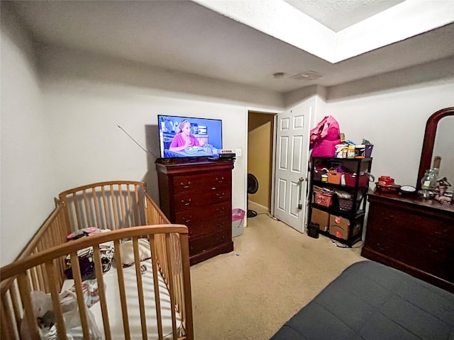 bedroom with light colored carpet