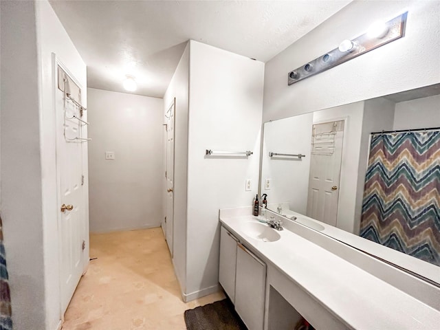 bathroom featuring vanity and a shower with curtain