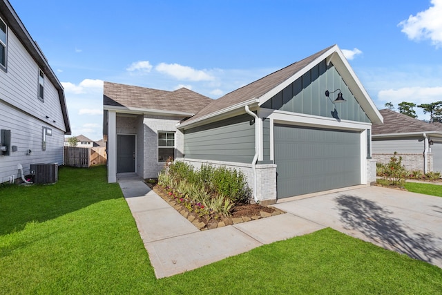 view of front of property with cooling unit and a front yard