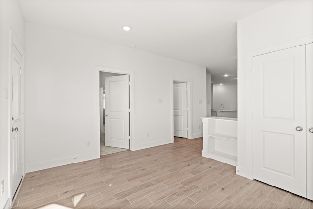 spare room with light wood-type flooring